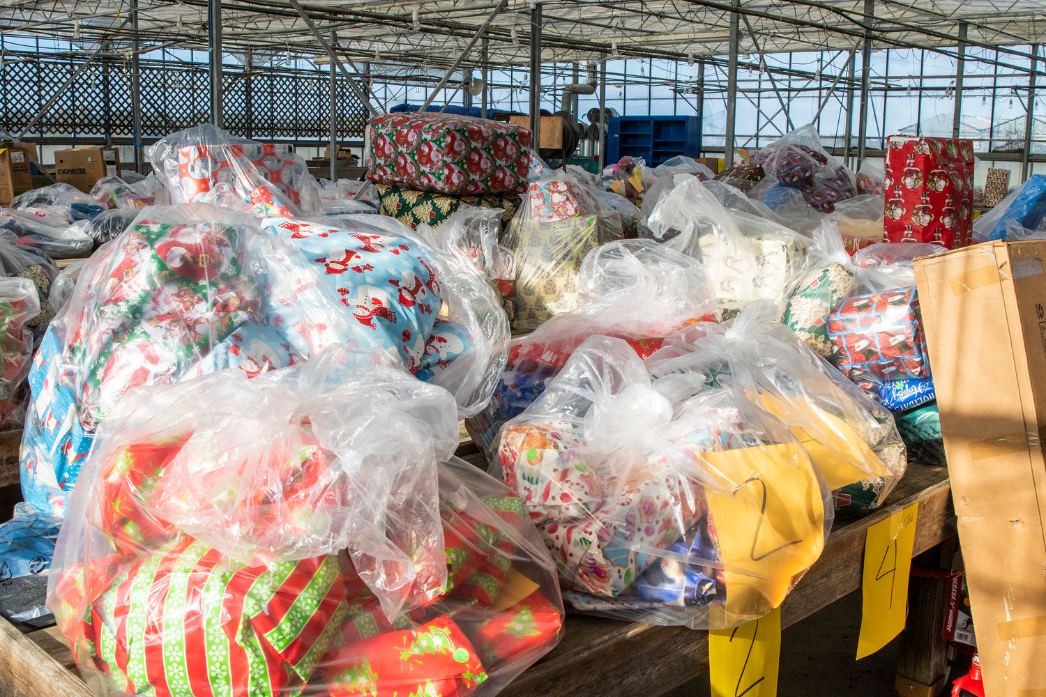Hundreds of bags of toys, coats and warm clothes are given to island families in need by Inky Santa every year.