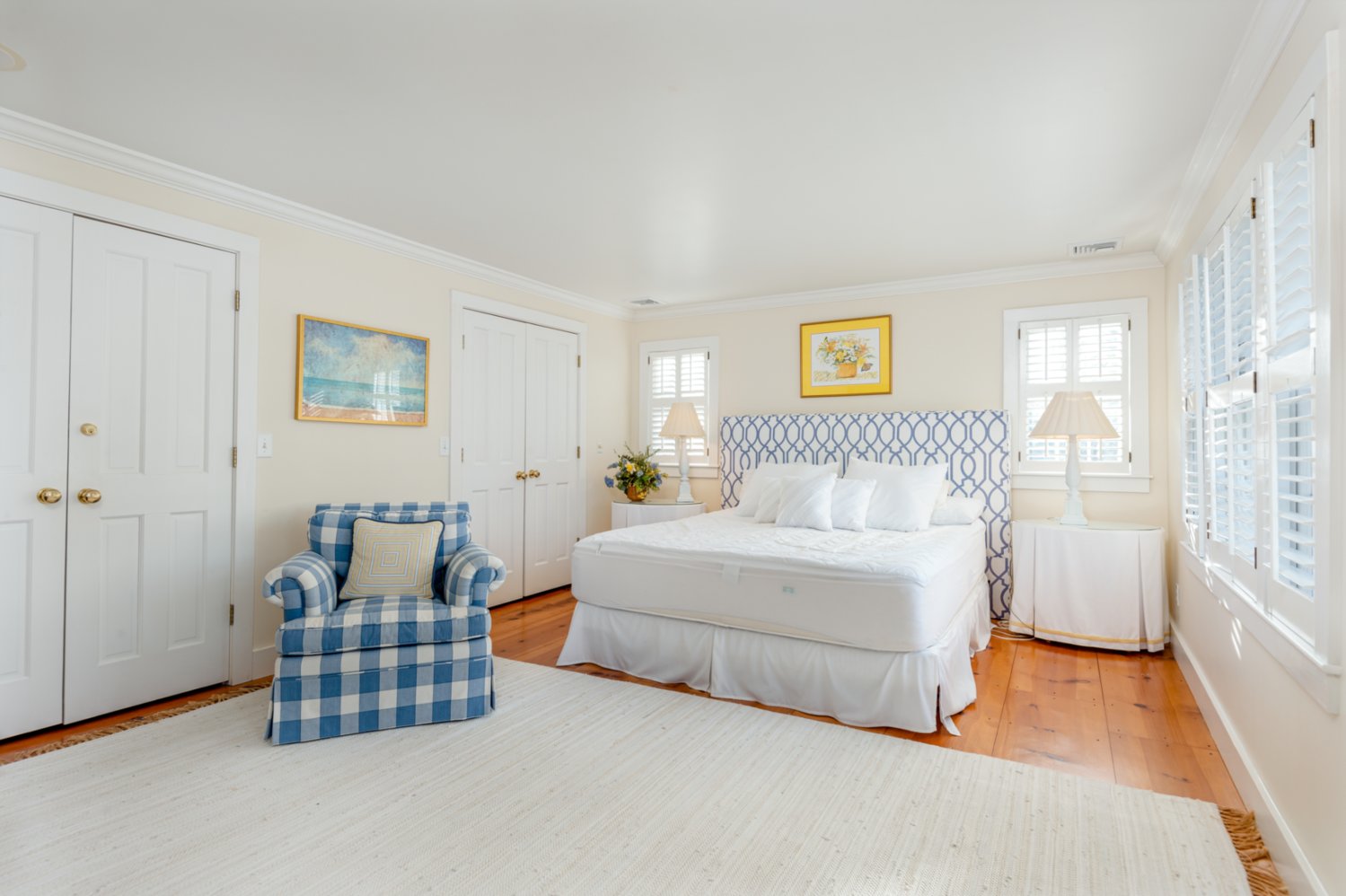The master bedroom has ample closet space and access to a private deck.