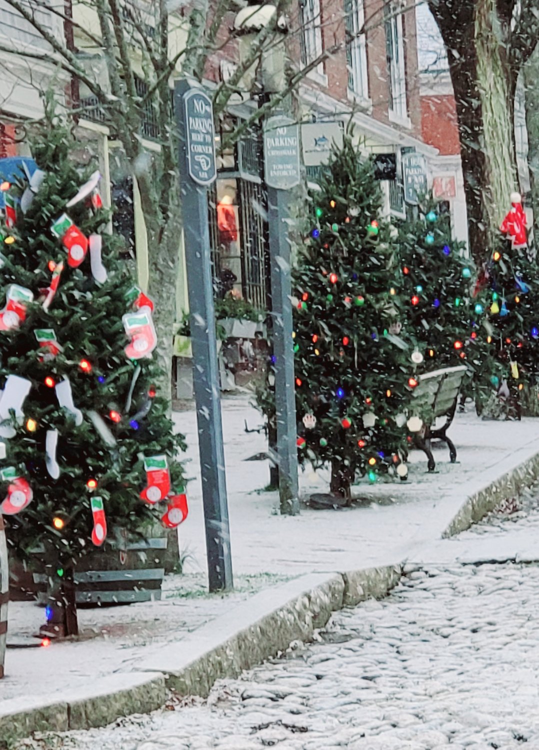 Snow falls on a deserted Main Street Christmas Eve morning.