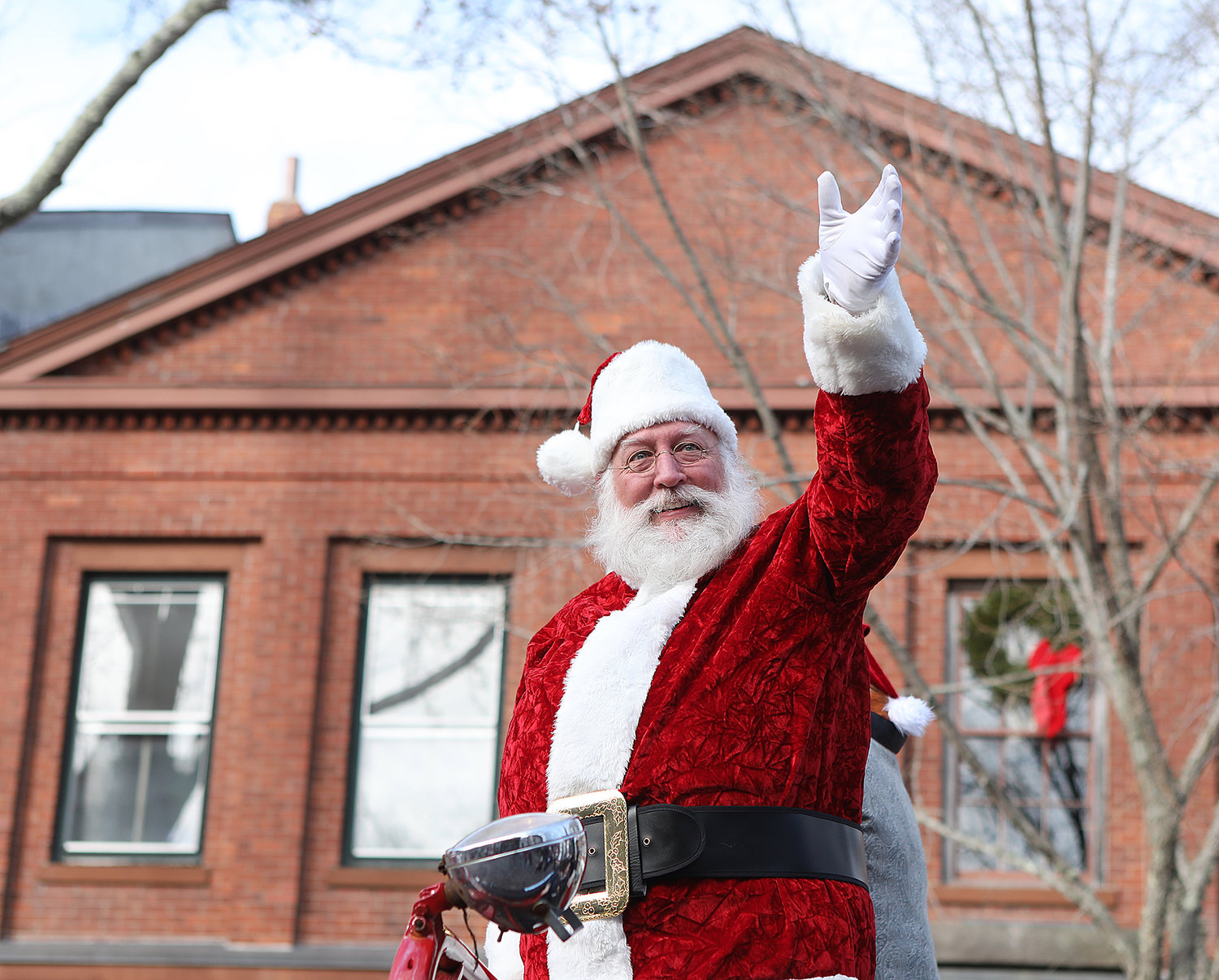 Santa waves to the crowd on Main Street on Saturday of Stroll weekend.