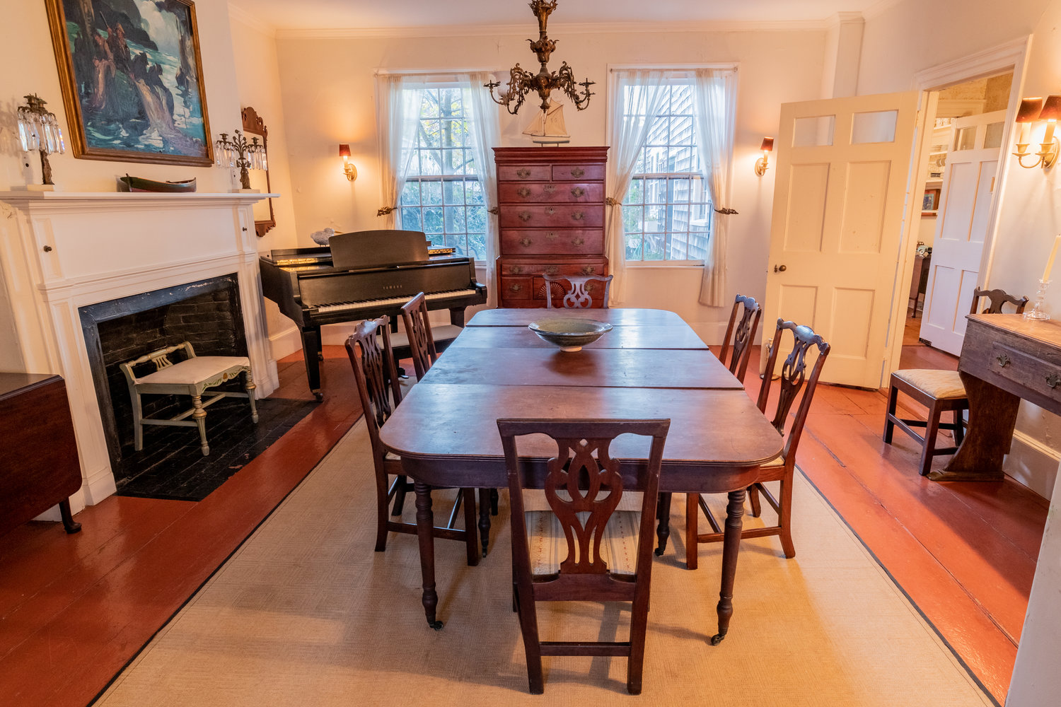 The dining room has antique wood floors, a fireplace and built-in cabinetry.