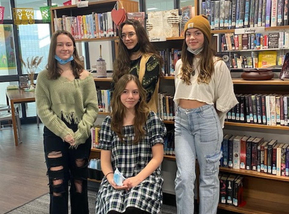 Nantucket High School Poetry Out Loud winner Gabriella Fee, seated, with from left, first runner-up Ella Scott and honorable-mention winners Anna Popnikolova and Áille Sweeney. Not pictured is honorable-mention winner Kipper Buccino.