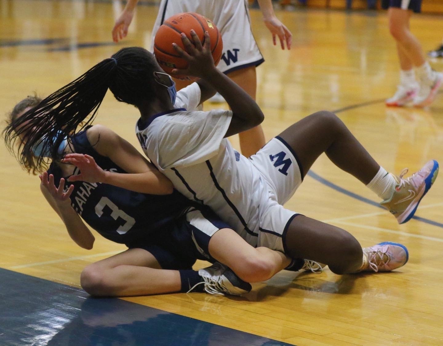 Ciara Barnett fights for the ball against Cape Cod Academy on Tuesday. The girls lost the game 57-32.