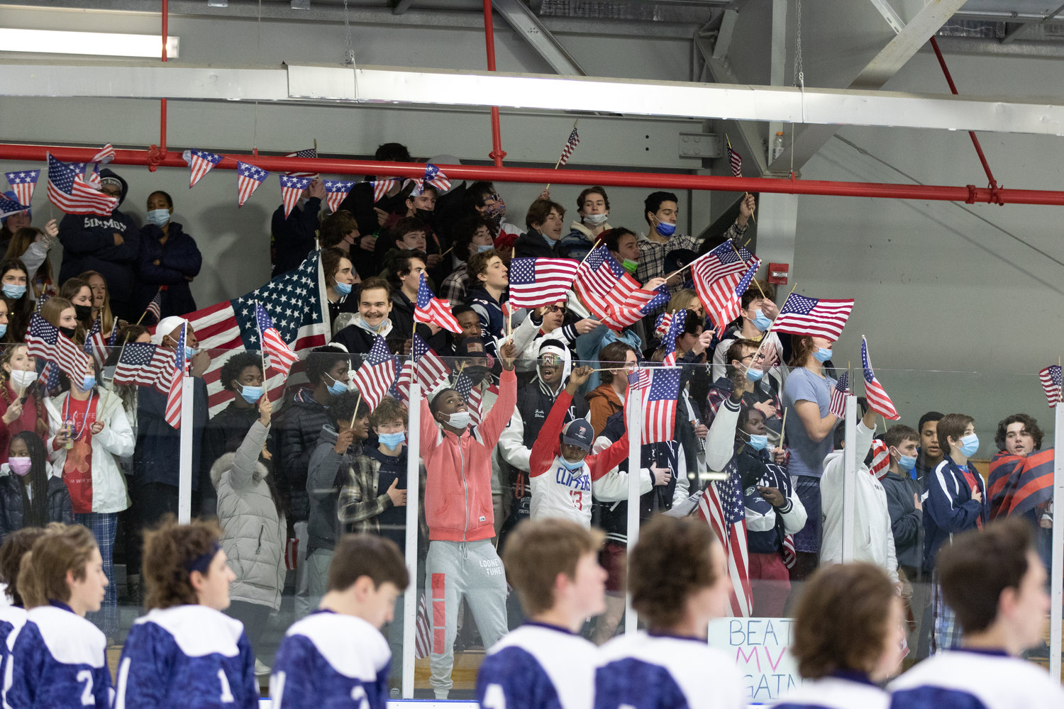 The USA-themed student section cheering on the Whalers boys hockey team, who went 7-8-4 this season and are bound for the playoffs.
