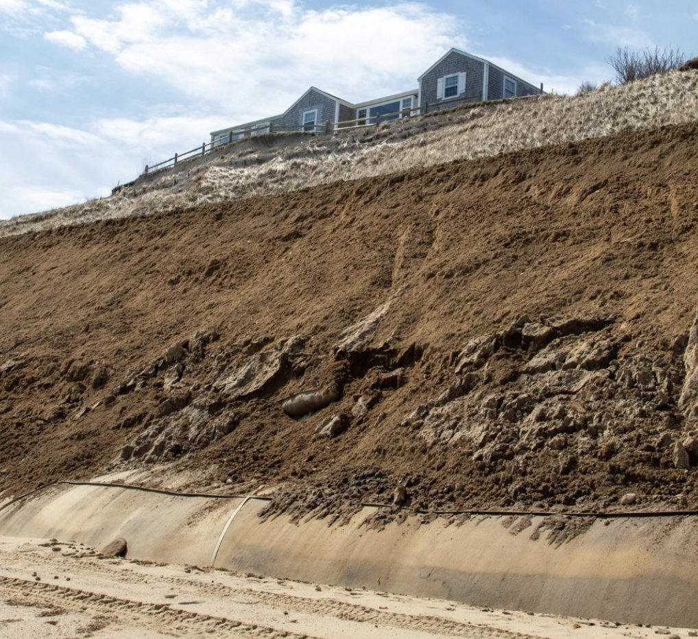 This photo, showing the geotextile tubes at the toe of the Sankaty Bluff, partially covered with sand, was taken in March 2020.