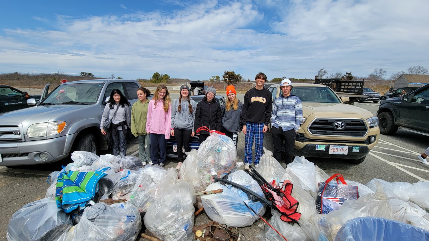 Members of Nantucket High School's National Honor Society team "Trash Talkers" and their haul they collected across the island.
