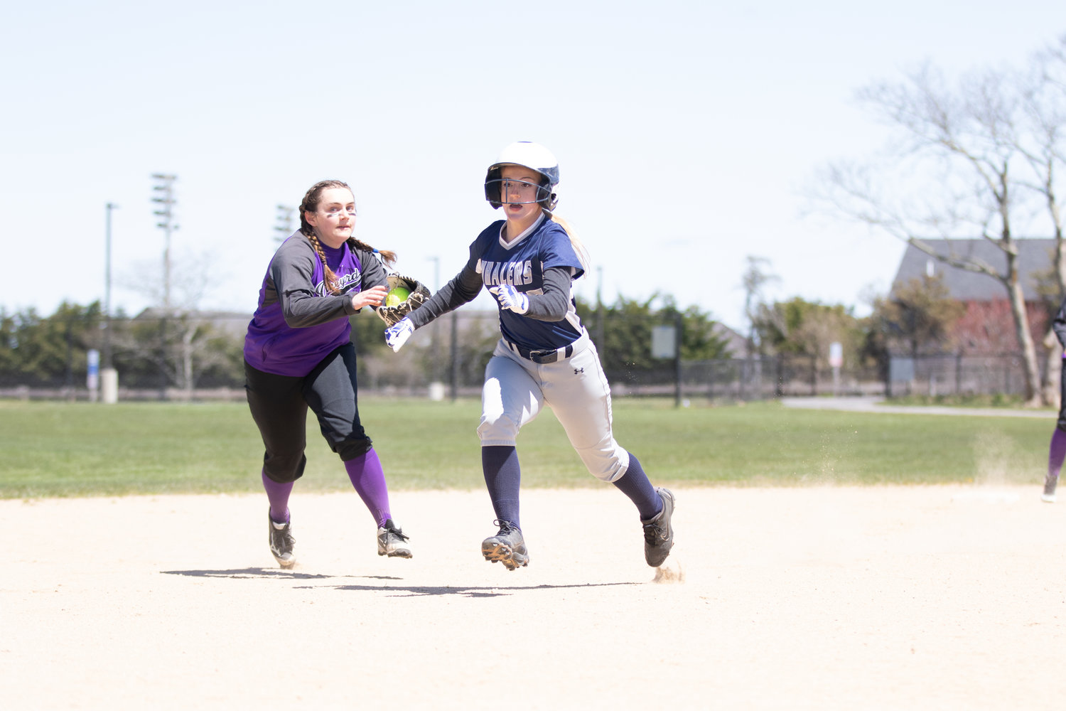 Lola Caron runs past the tag of an outstretched Vineyard infielder.