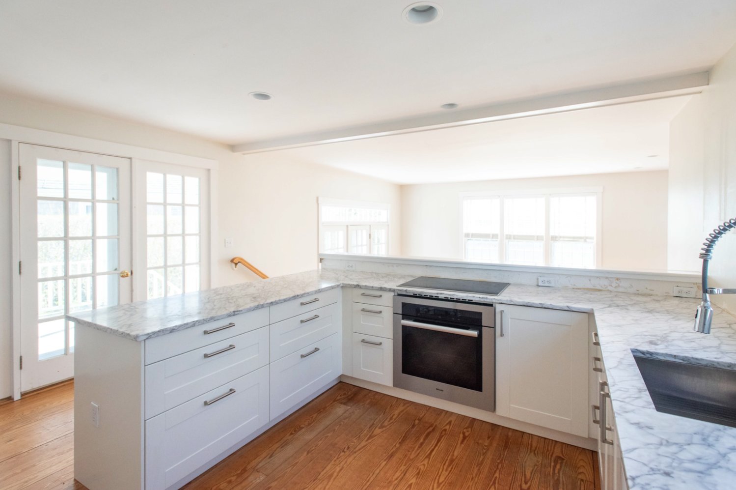 The kitchen of this Goldfinch Drive home was recently renovated with Italian marble countertops and new appliances, including a Miele stove.