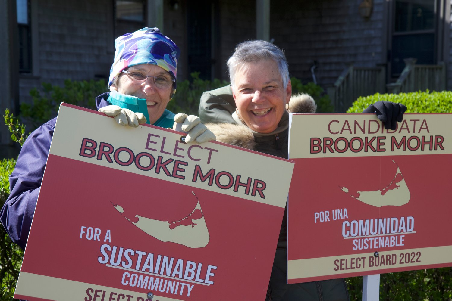 Candidate Brooke Mohr and supporter Deb Dubois stood outside for hours on Tuesday in the cold, windy and sometimes rainy weather, holding placards urging voters to cast their vote for Mohr for the Select Board
