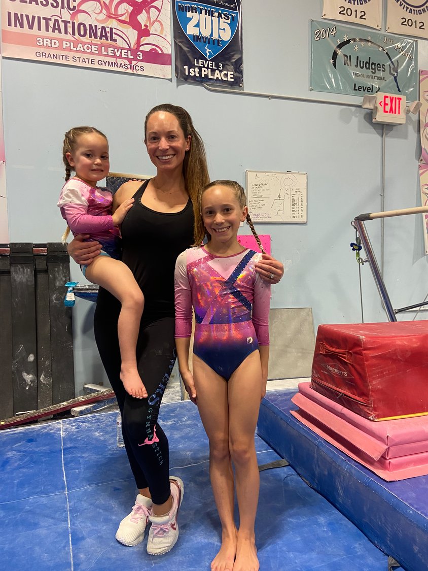 Rachel Powers Daily with her daughters Daisy, 9, and Idalence, 4, at an off-island gymnastics competition.