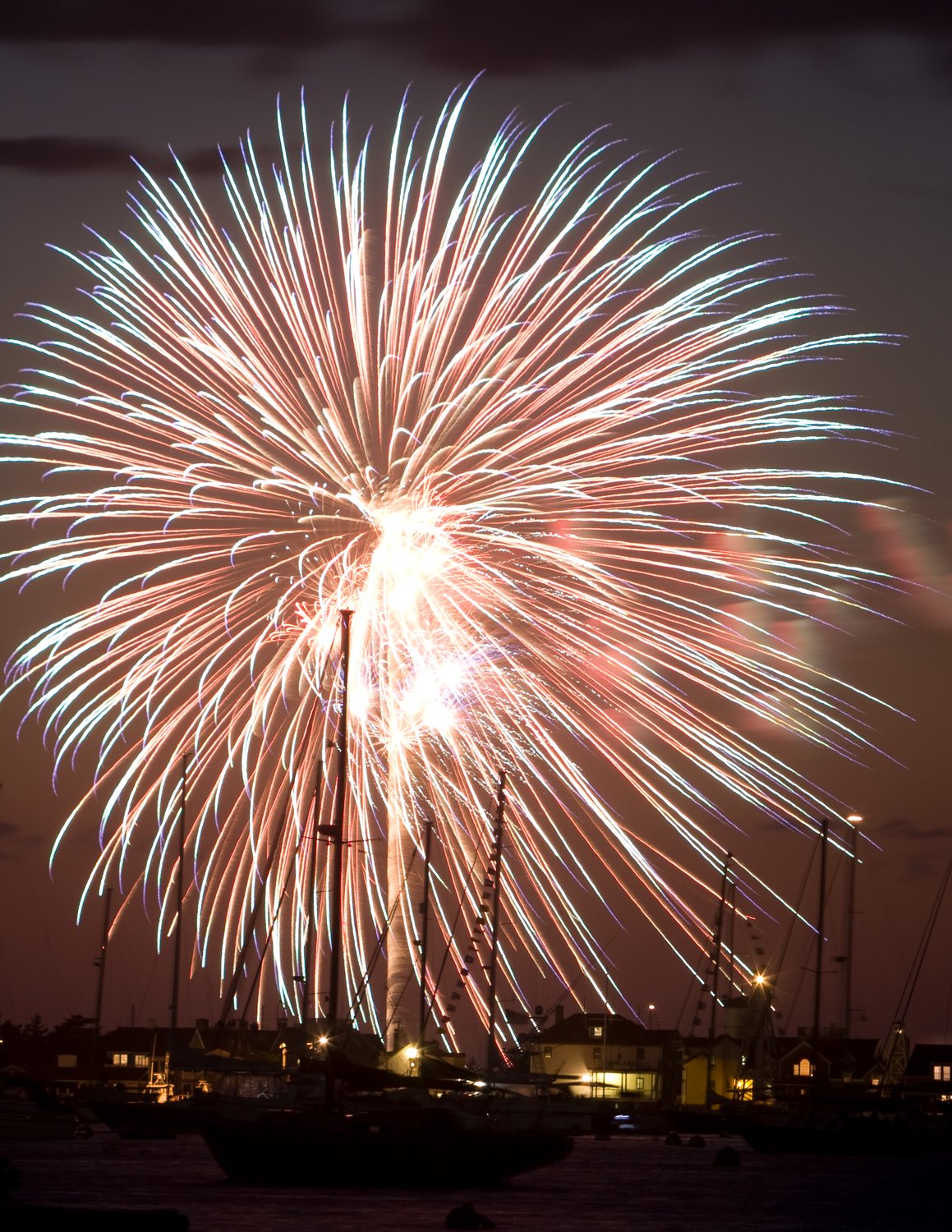 Fireworks explode over Nantucket Harbor on the Fourth of July.