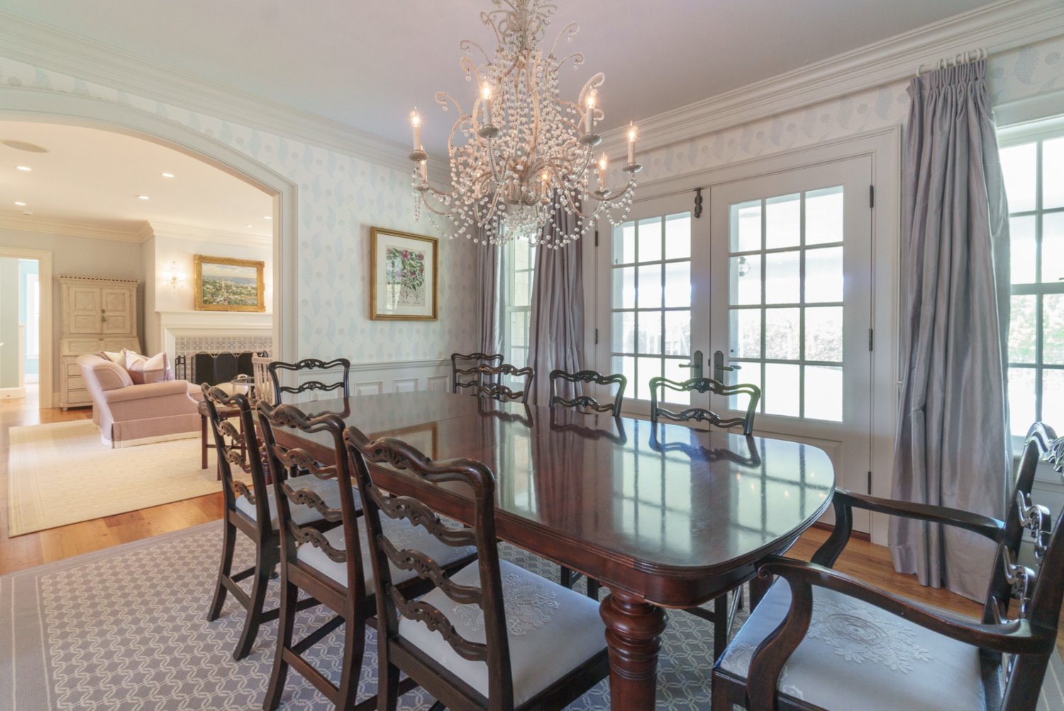 The formal dining room has seating for at least eight, French-door access to the covered deck, and pocket doors for additional privacy.