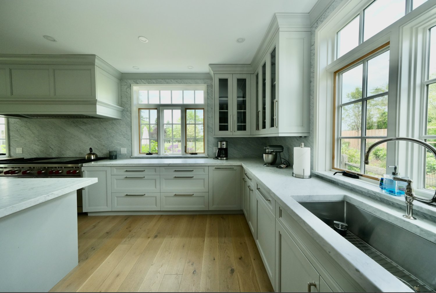 The gourmet kitchen has stone countertops, a spacious center island and high-end appliances by Wolf, Sub-Zero and Miele.