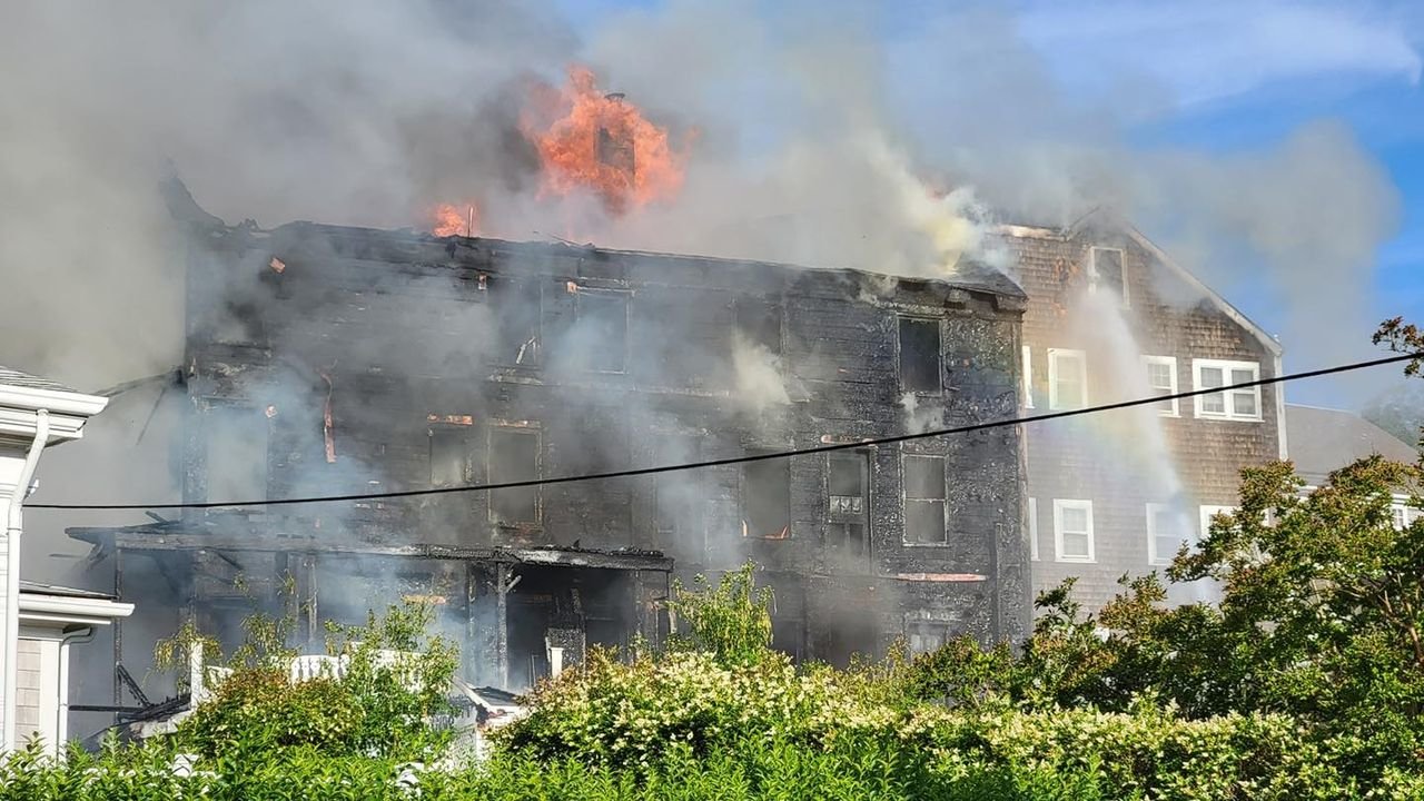 Flames leap from the Veranda House hotel Saturday morning.