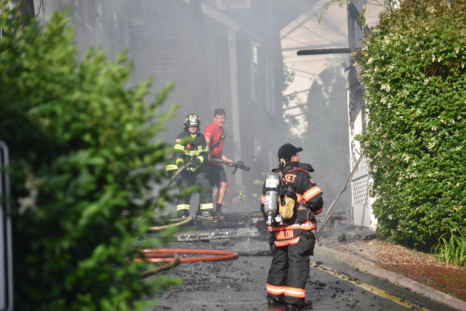 Firefighters put water on the blaze from Step Lane.