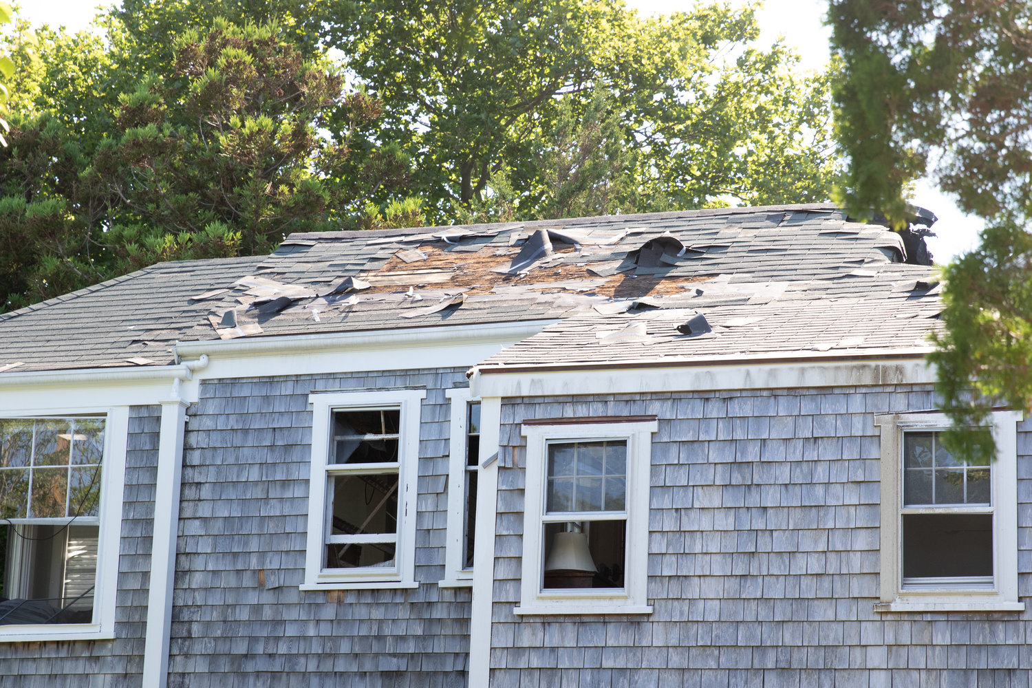 Debris on the roof of a nearby cottage.
