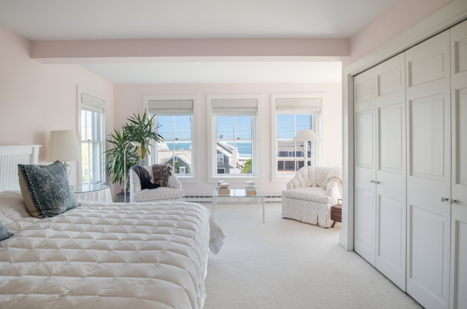 The second-floor master bedroom has a sitting area, ample closet space and an en-suite bath.