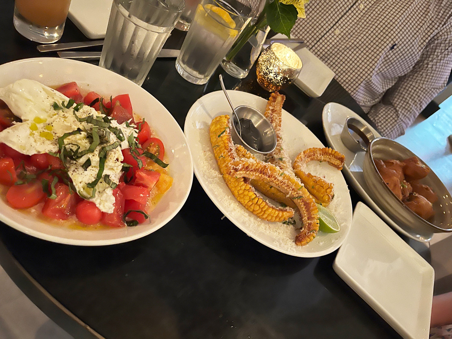 The appetizers, like the entrées, are meant to be shared. Above are the heirloom tomato salad and the street corn.
