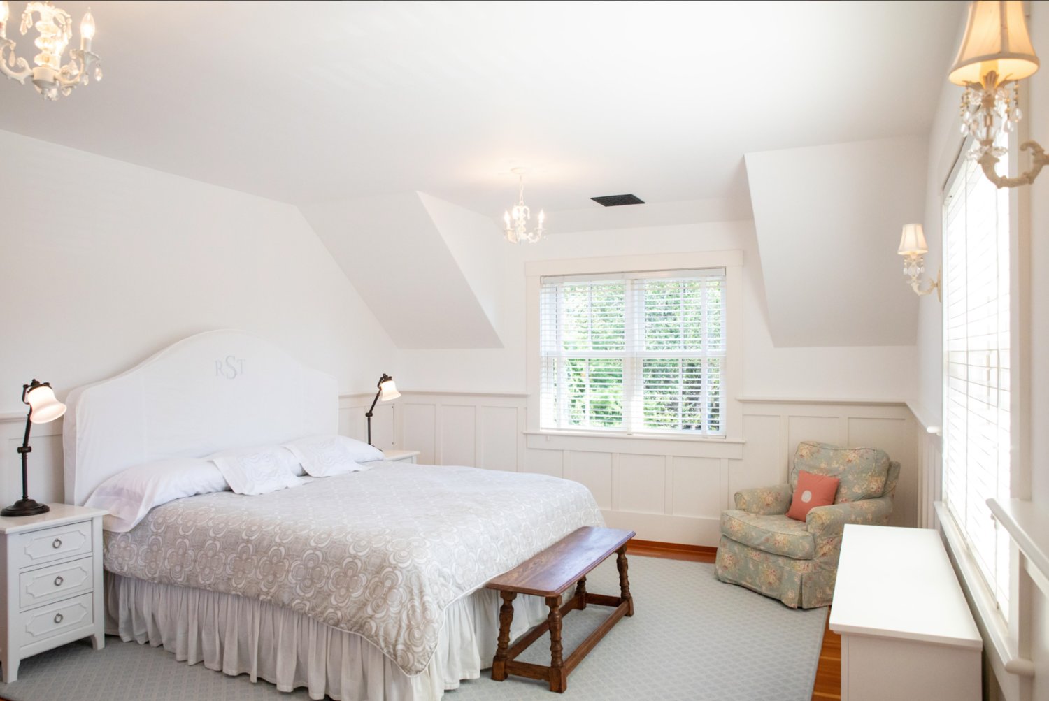 This second-floor bedroom has a vaulted ceiling and plenty of natural light.