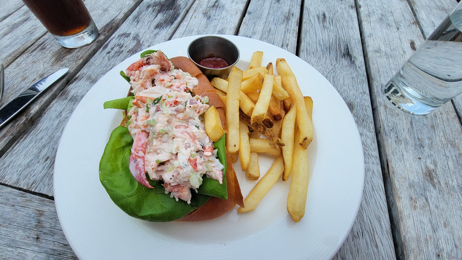 The Breeze’s lobster roll is overflowing with lobster meat poached in tarragon butter and mixed with finely-diced celery and onion.