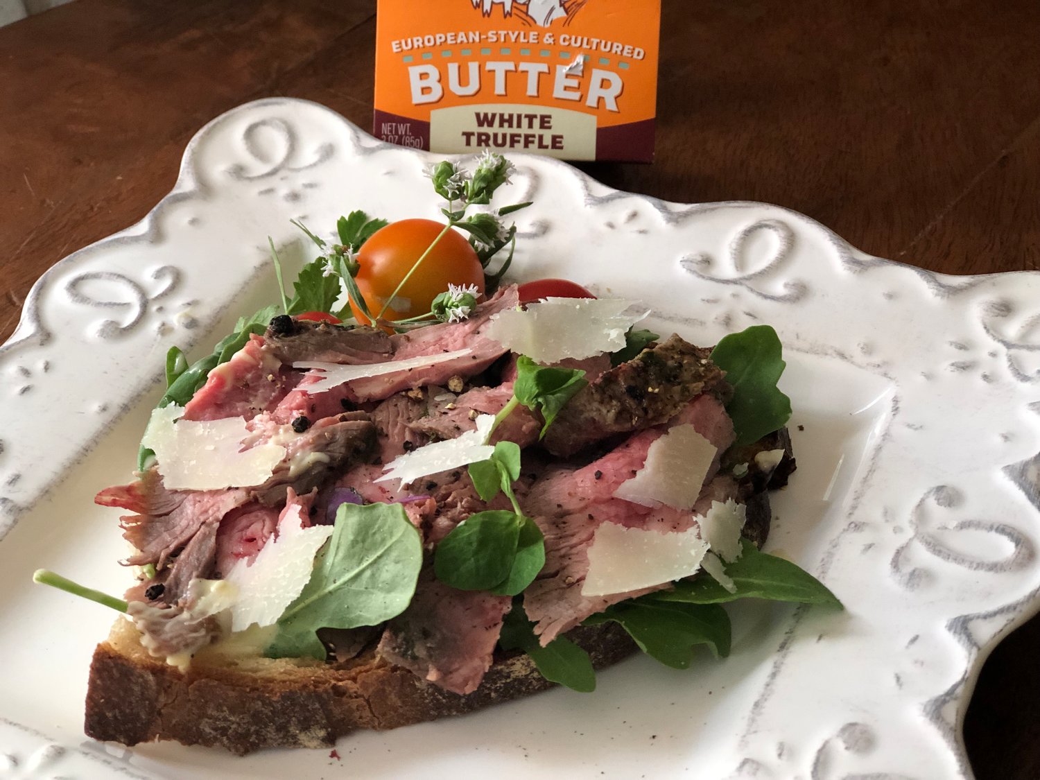 These open-face steak and truffle butter sandwiches are made with thinly-sliced leftover steak and topped with shaved Parmigiano-Reggiano cheese.