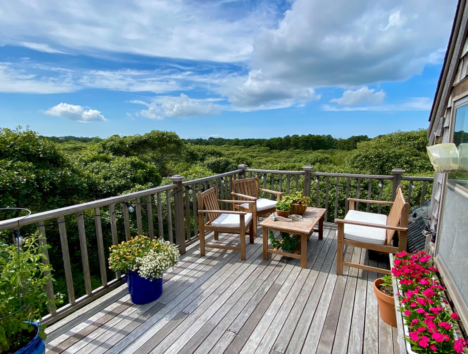 The wood deck overlooking hundreds of acres of conservation land is the perfect spot to greet the day or catch the sunset.