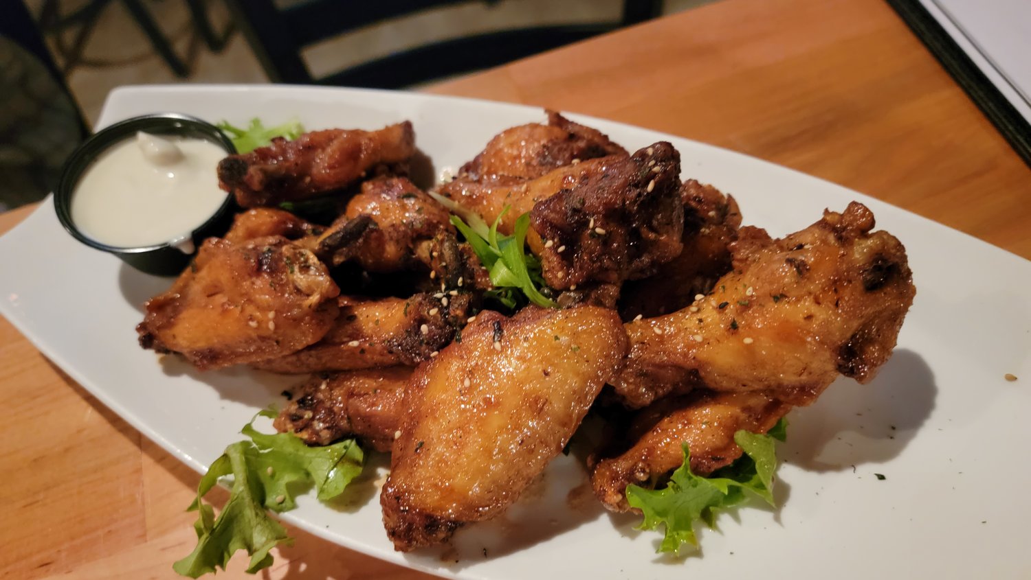 The chicken wings are available in a number of different varieties, including traditional Buffalo and Korean barbecue, above.