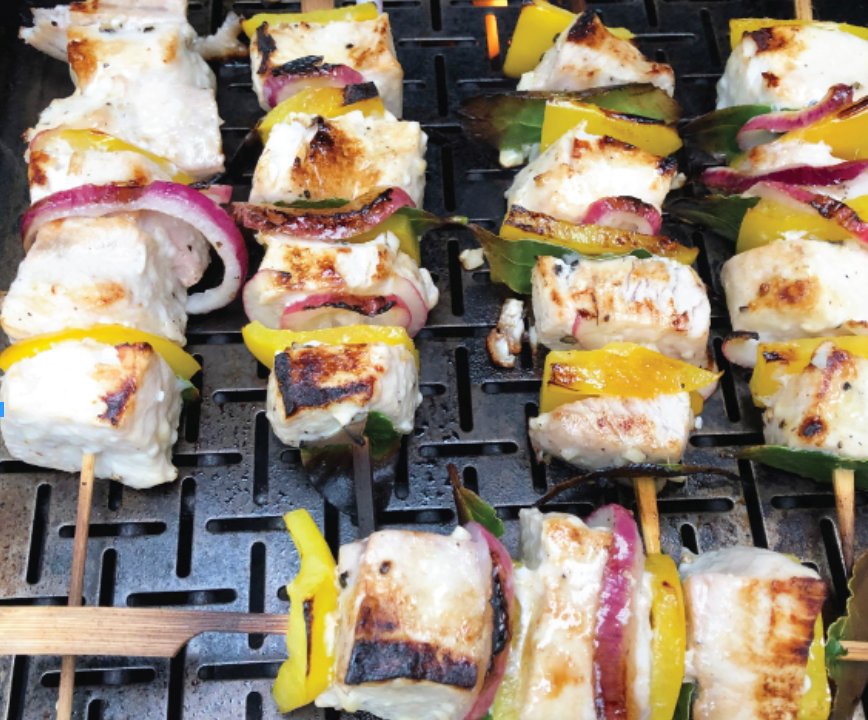 Turkish Swordfish Kebabs with Lemon and Bay Leaves are enhanced by onions and yellow bell peppers.
