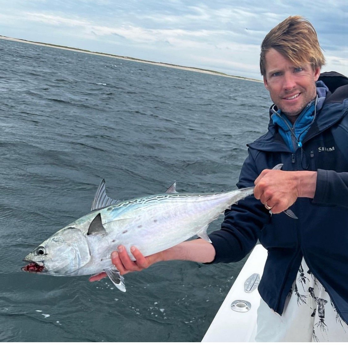 Capt Corey Gammill with a large false albacore on the south shore.