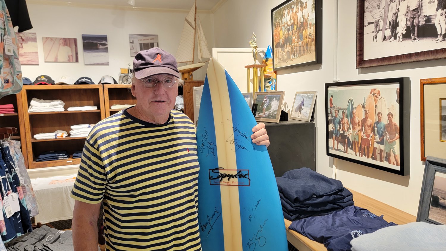 Wright at his surf shop on Main Street this summer.