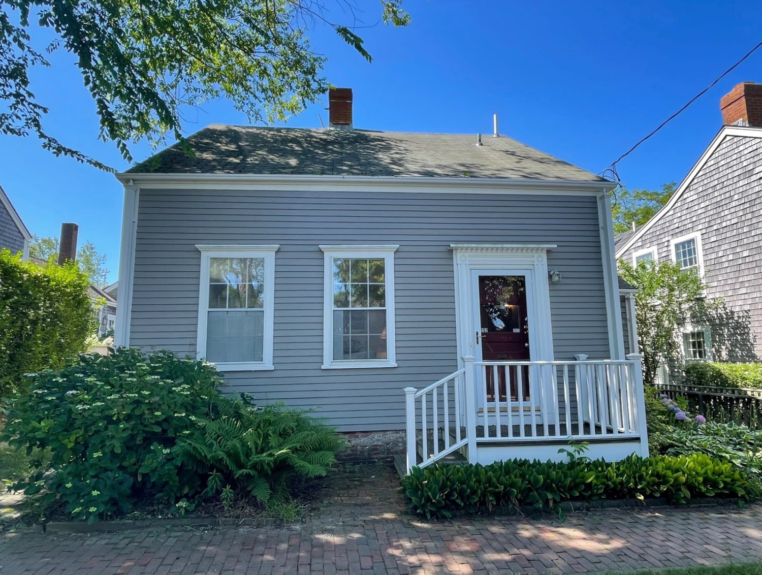 Located at the top of picturesque Main Street, this five-bedroom, two-bathroom home has frontage on two streets and takes advantage of all that the town has to offer.