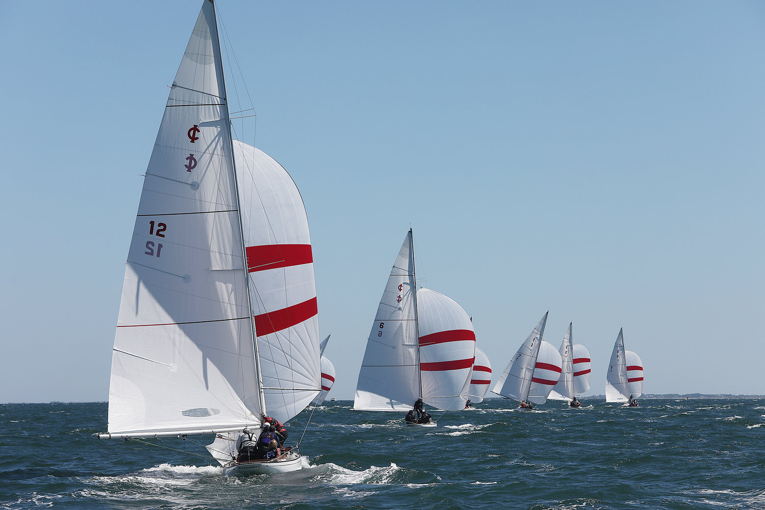 AUGUST 18, 2022 -- Nantucket Race Week. Day 6. Boats head downwind with spinnakers during the International One Design Celebrity Invitational in Nantucket Sound on Thursday. Photo by Ray K. Saunders