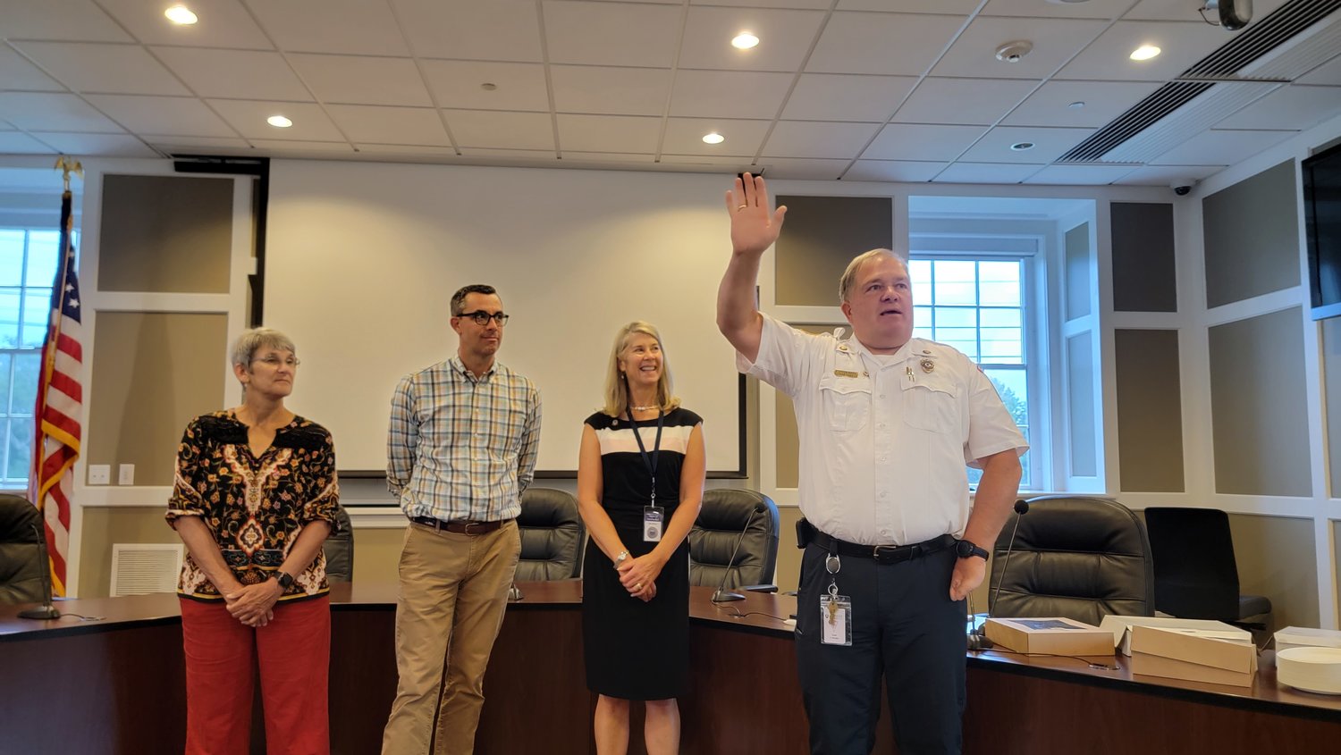 Fire chief Steve Murphy, right, thanks those in attendance at his retirement celebration Tuesday at the Fairgrounds Road Public Safety Facility. From left are Select Board members Brooke Mohr and Jason Bridges, and town manager Libby Gibson.
