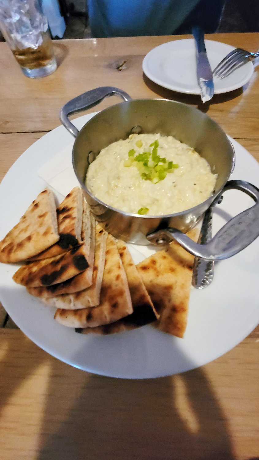 The warm artichoke dip with house-made pita chips is a simple dish done right.