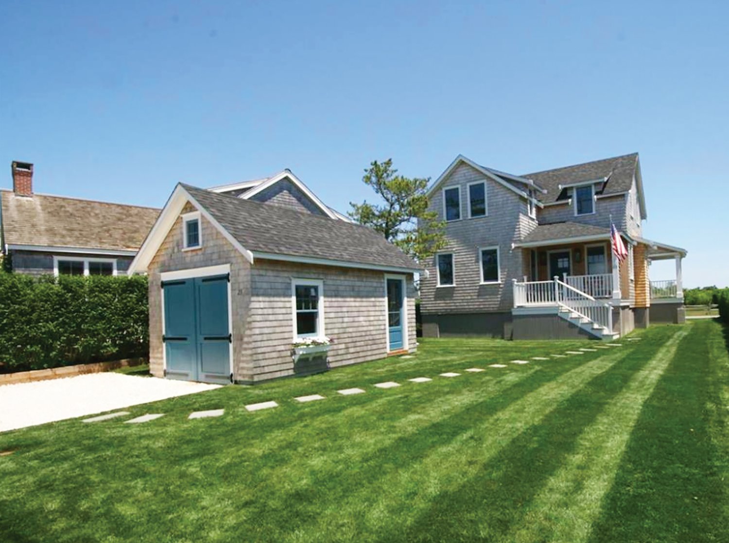 Located in the heart of Brant Point, this four-bedroom, four-and-a-half bathroom home sits on just over a tenth of an acre with a large yard and a garage.