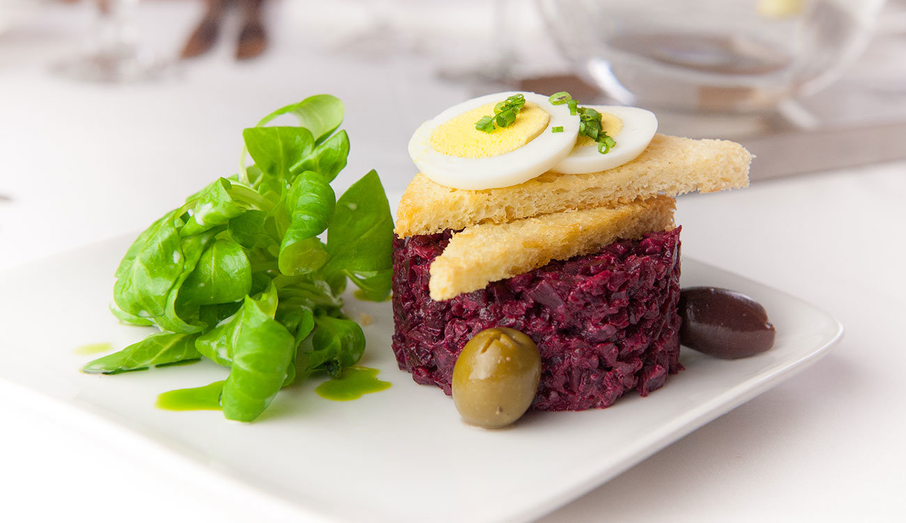 The Landguedoc’s beet salad, chopped fine like a tartare, is garnished with watercress, hard-boiled egg and toast points.