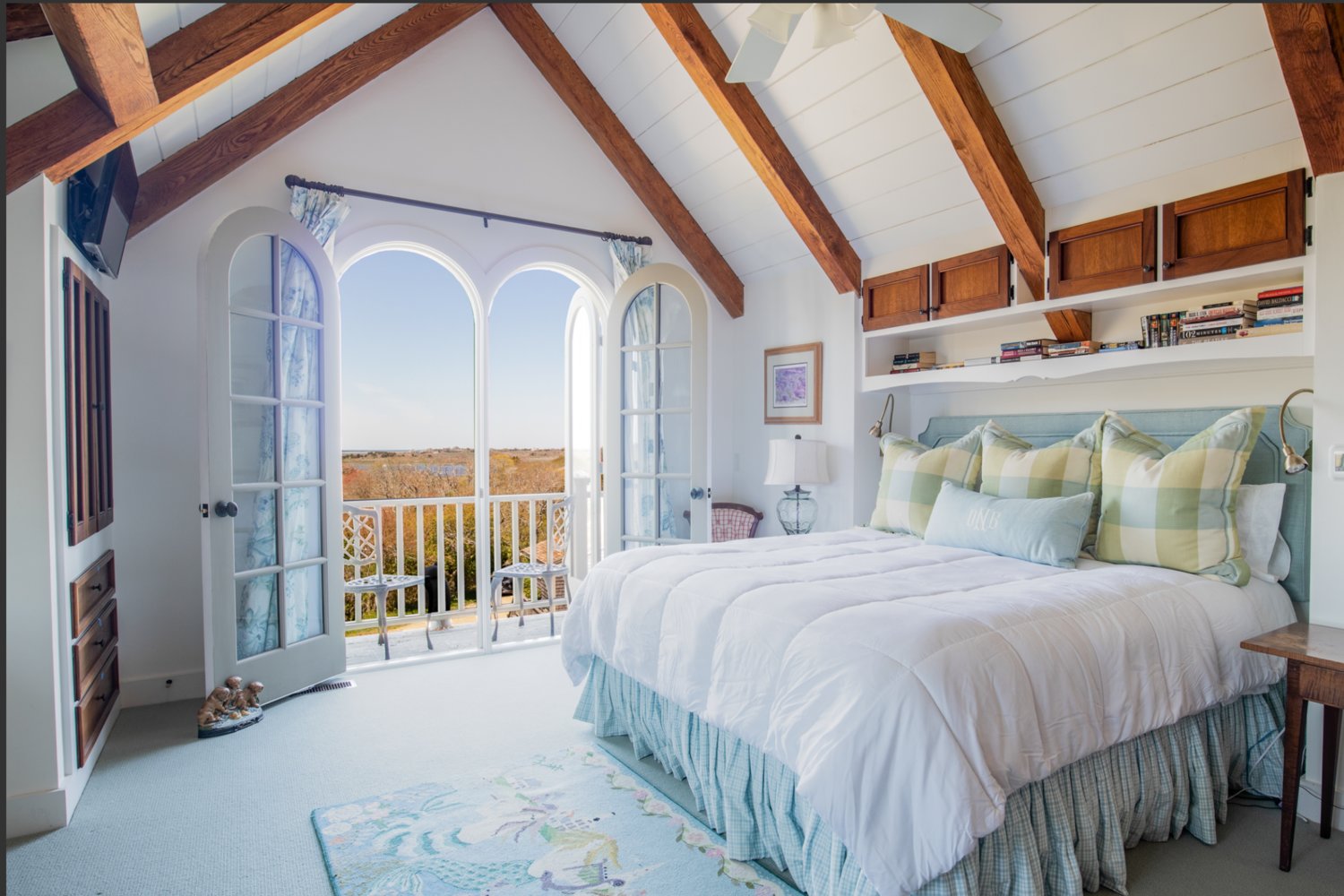 The second-floor master bedroom has a vaulted ceiling and a terrace.