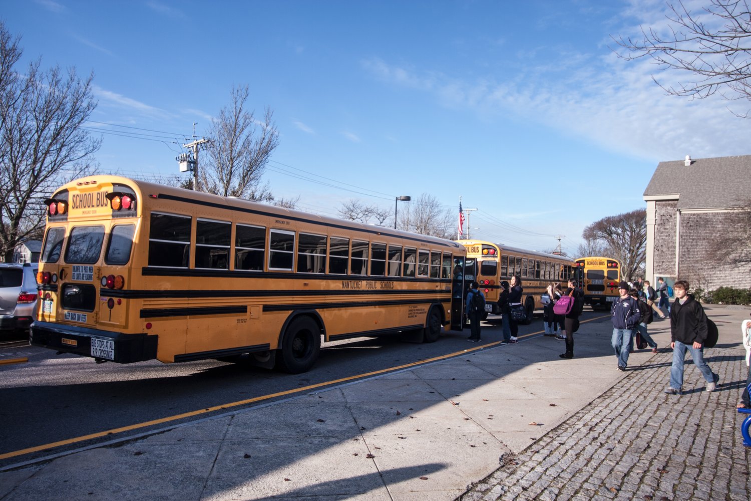 Buses line up outside Nantucket High School.