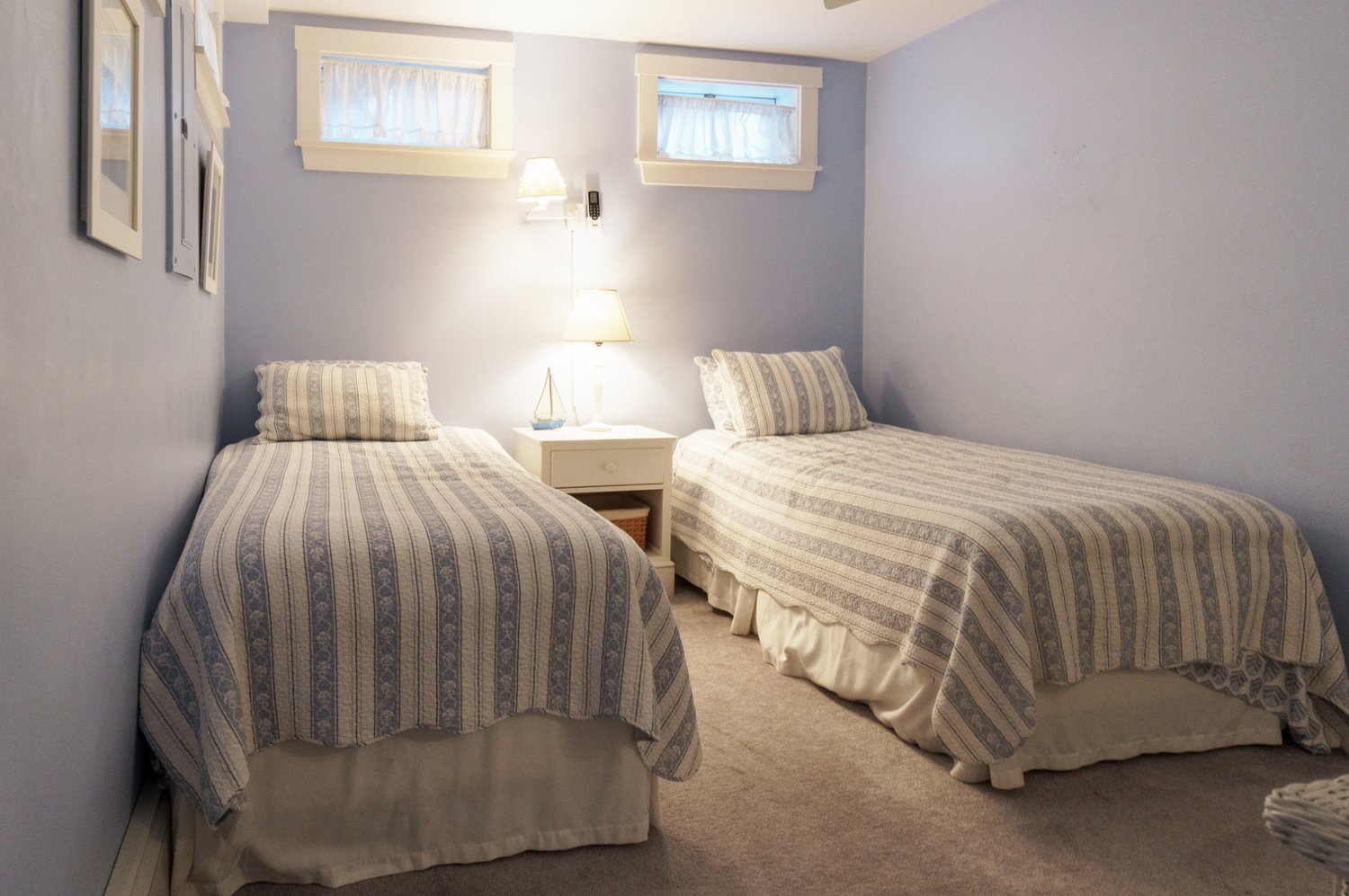The guest bedroom has more than enough room for a pair of twin beds.