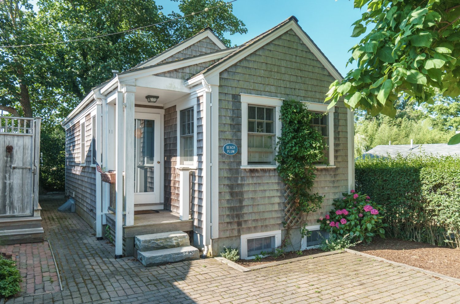 If a quaint Nantucket experience on a quiet downtown street is what you seek, look no further than this two-bedroom, two-bathroom property in the heart of Nantucket’s historic district.