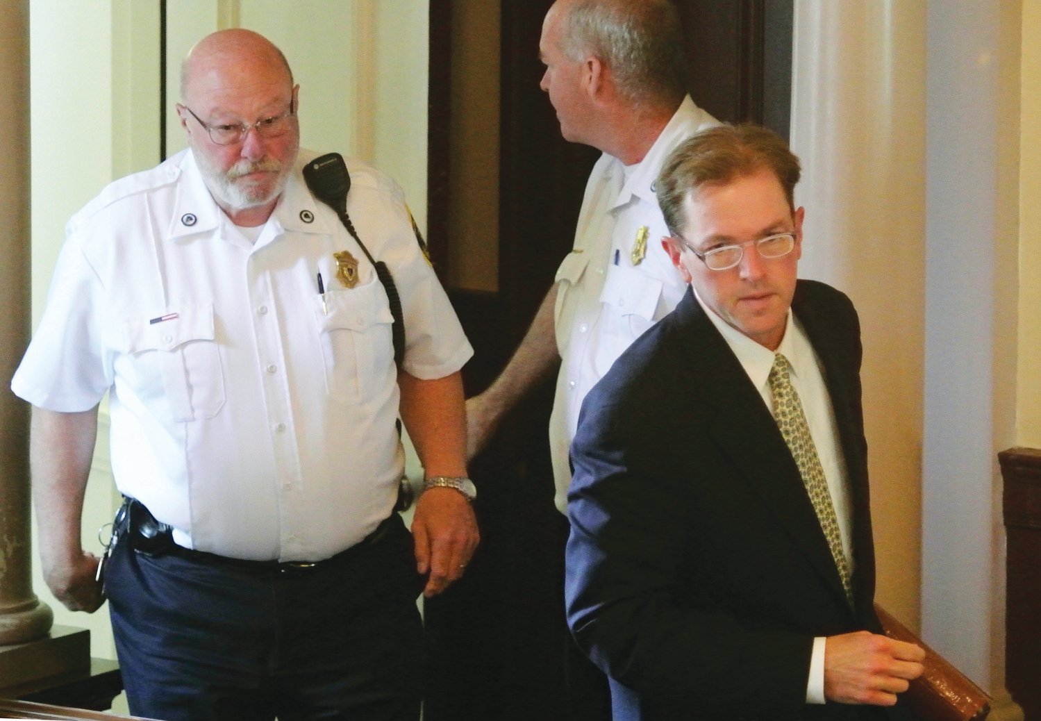 Thomas Toolan III, right, is brought into Barnstable Superior Court in 2013 during his second trial for the first-degree murder of Elizabeth Lochtefeld in her Nantucket home in 2004.