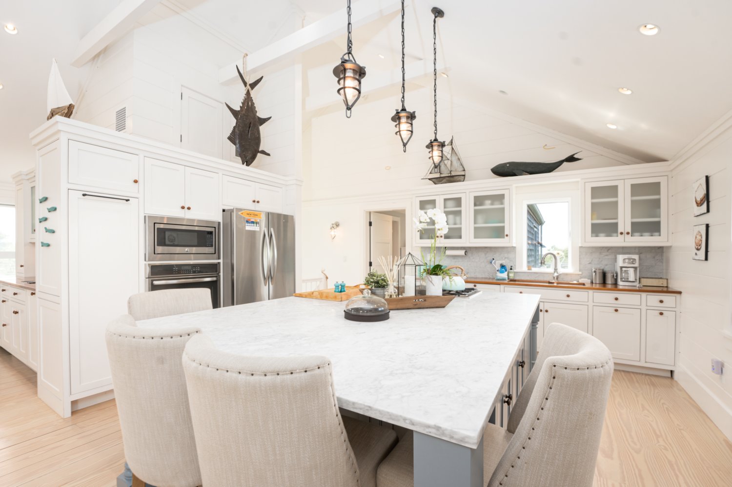The spacious second-floor gourmet kitchen has stainless-steel appliances, abundant storage space and an oversized center island with seating for four.