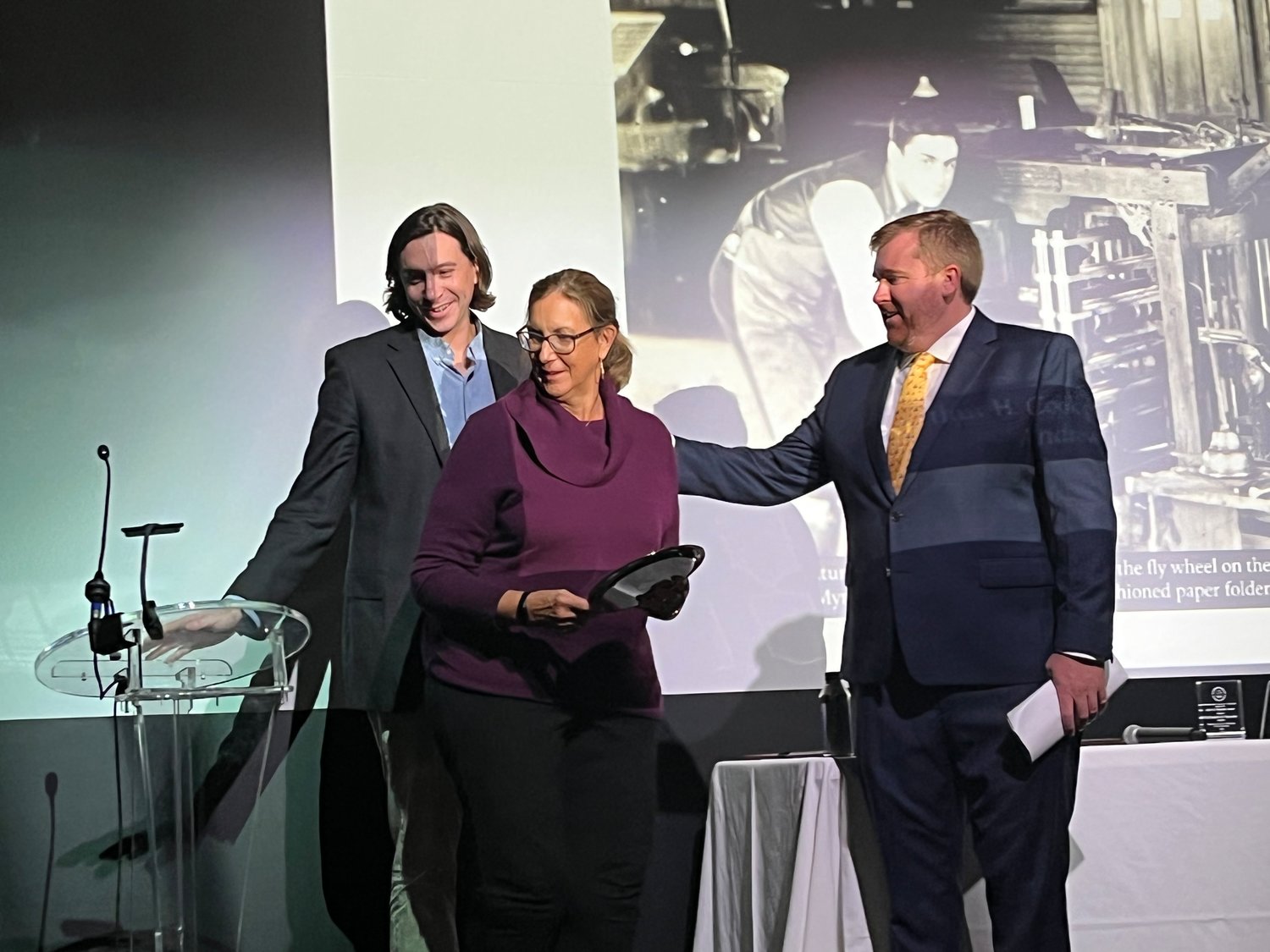 Chamber executive director Peter Burke congratulates The Inquirer and Mirror's Marianne and Kevin Stanton for winning the Chamber's Bicentennial Award.