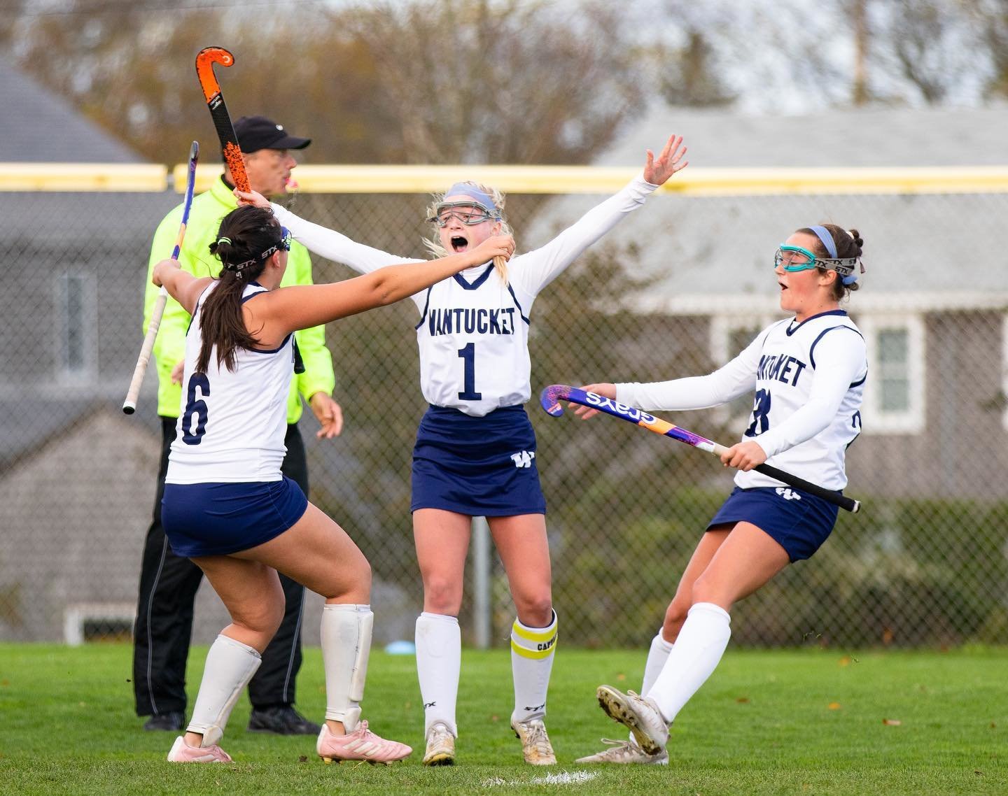 From left, Lily Remick, Caroline Allen and Maddie Lombardi celebrate after Allen's game-tying goal Friday against Monomoy.