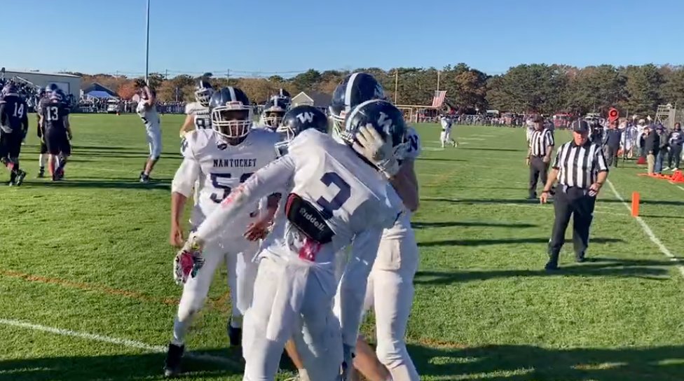 Kareem Maxwell is congratulated by teammates after scoring Nantucket's second touchdown.