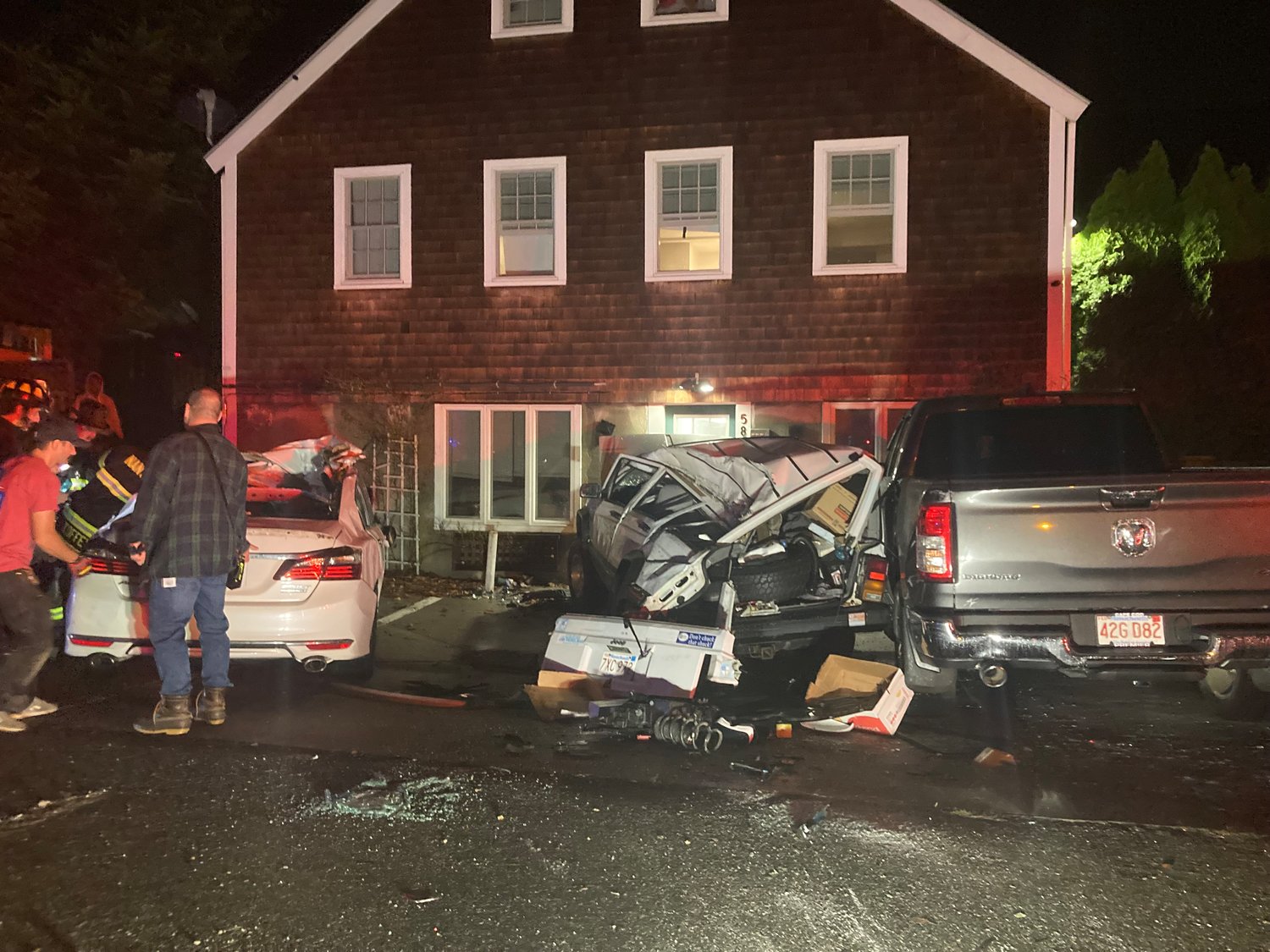 The aftermath of a car crash on Old South Road Tuesday night in which two cars, one parked, were overturned, and a parked Jeep heavily damaged.
