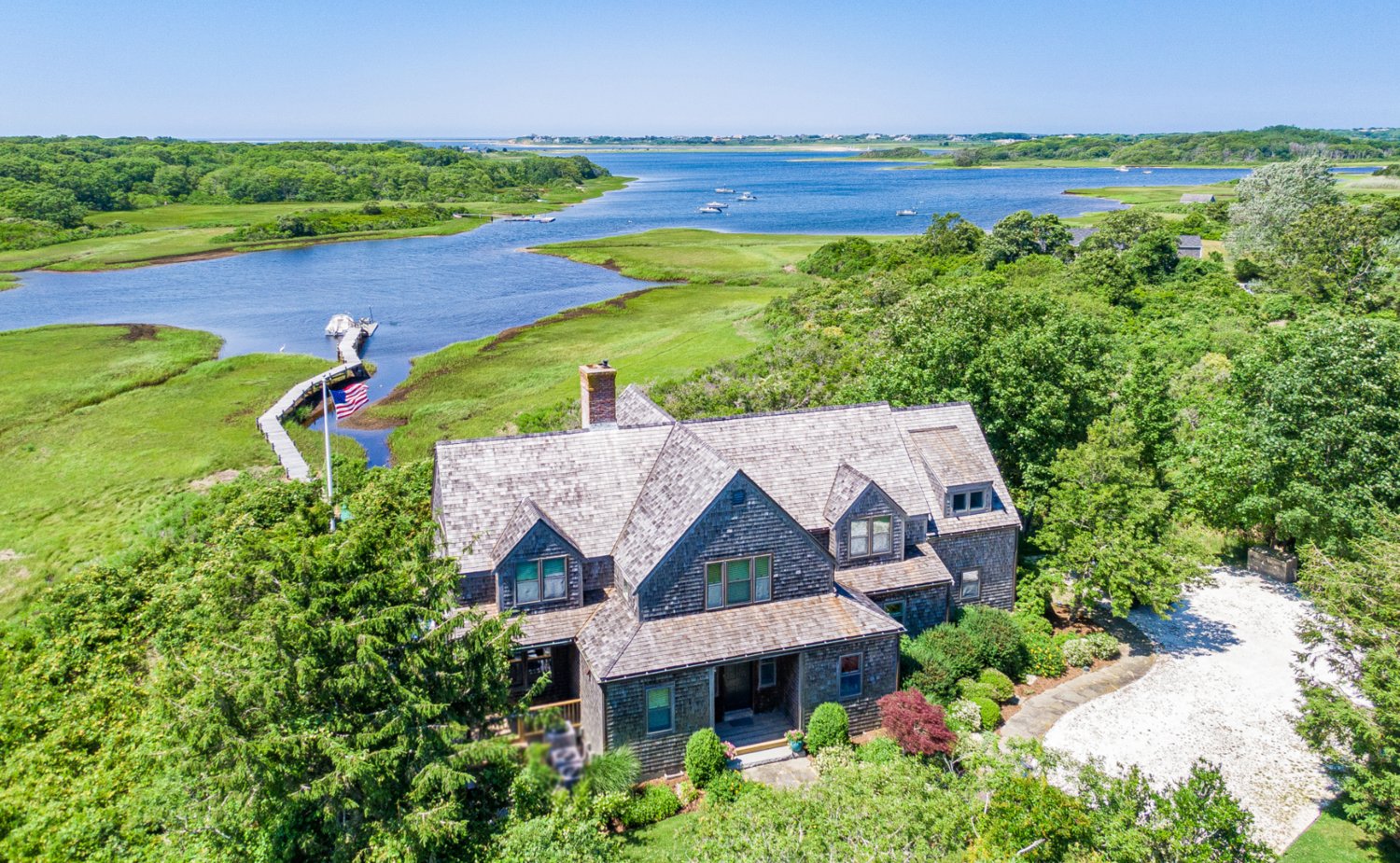 Located on 7.2 acres of picturesque land off Polpis Road, this four-bedroom, four-and-a-half-bathroom home has pristine water views.