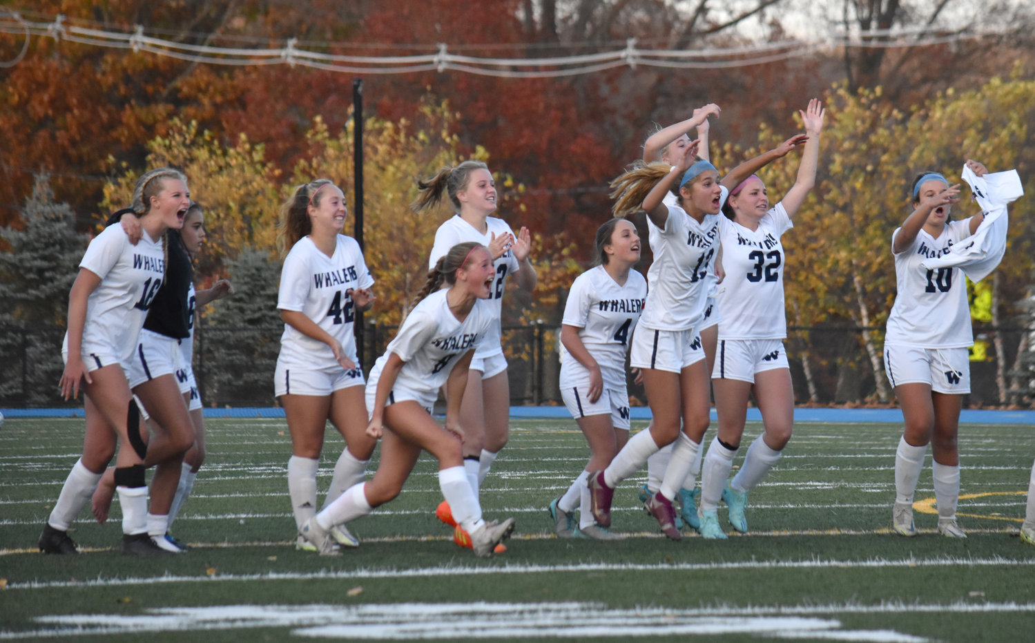 The Whalers celebrate a penalty kick goal during their 3-2 win over Assabet Valley Friday.