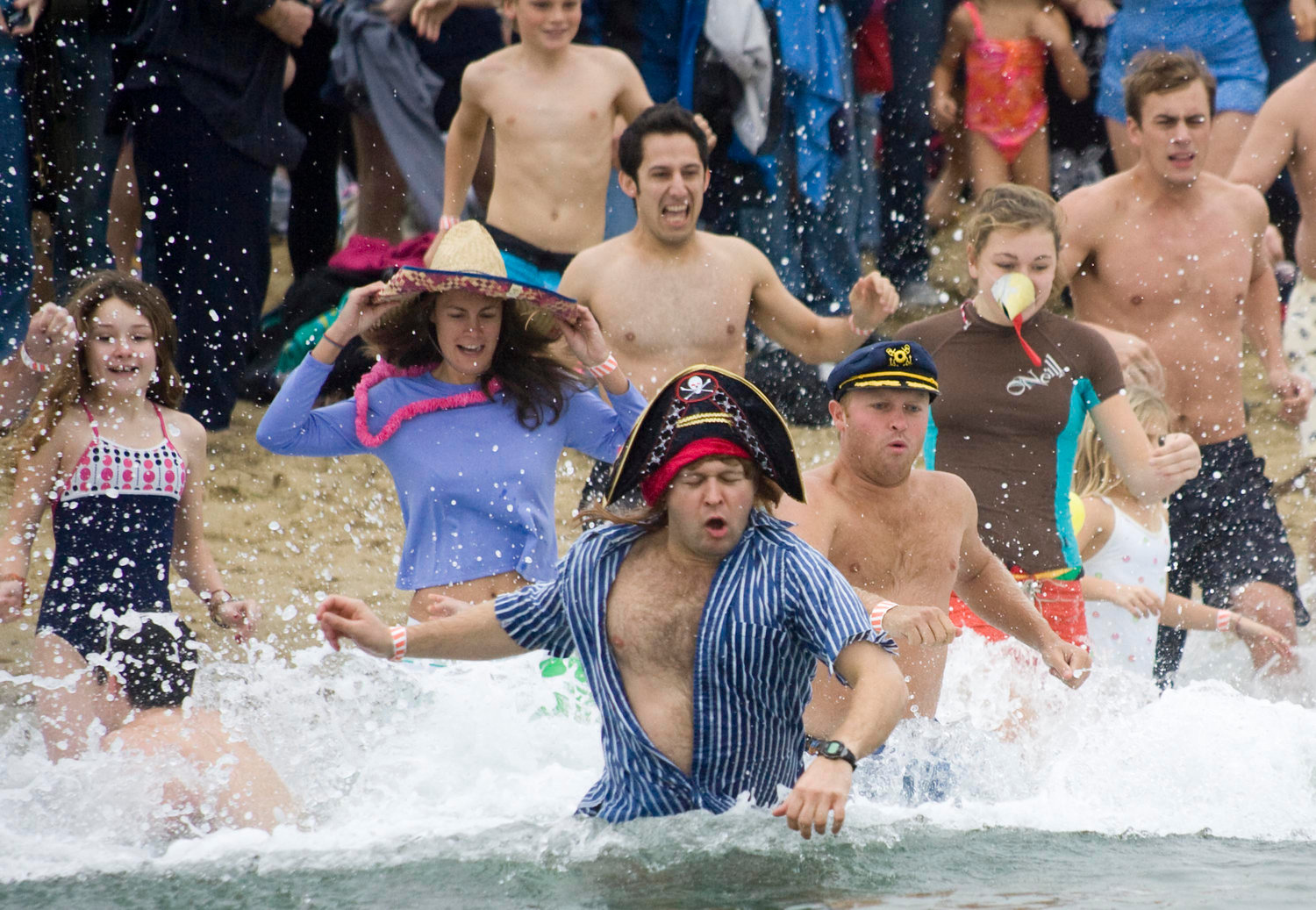 The Cold Turkey Plunge, a benefit for The Atheneum's children programs, at Children's Beach Thursday Nov. 26, 2009. Allen Breed enters the water in his pirate garb.