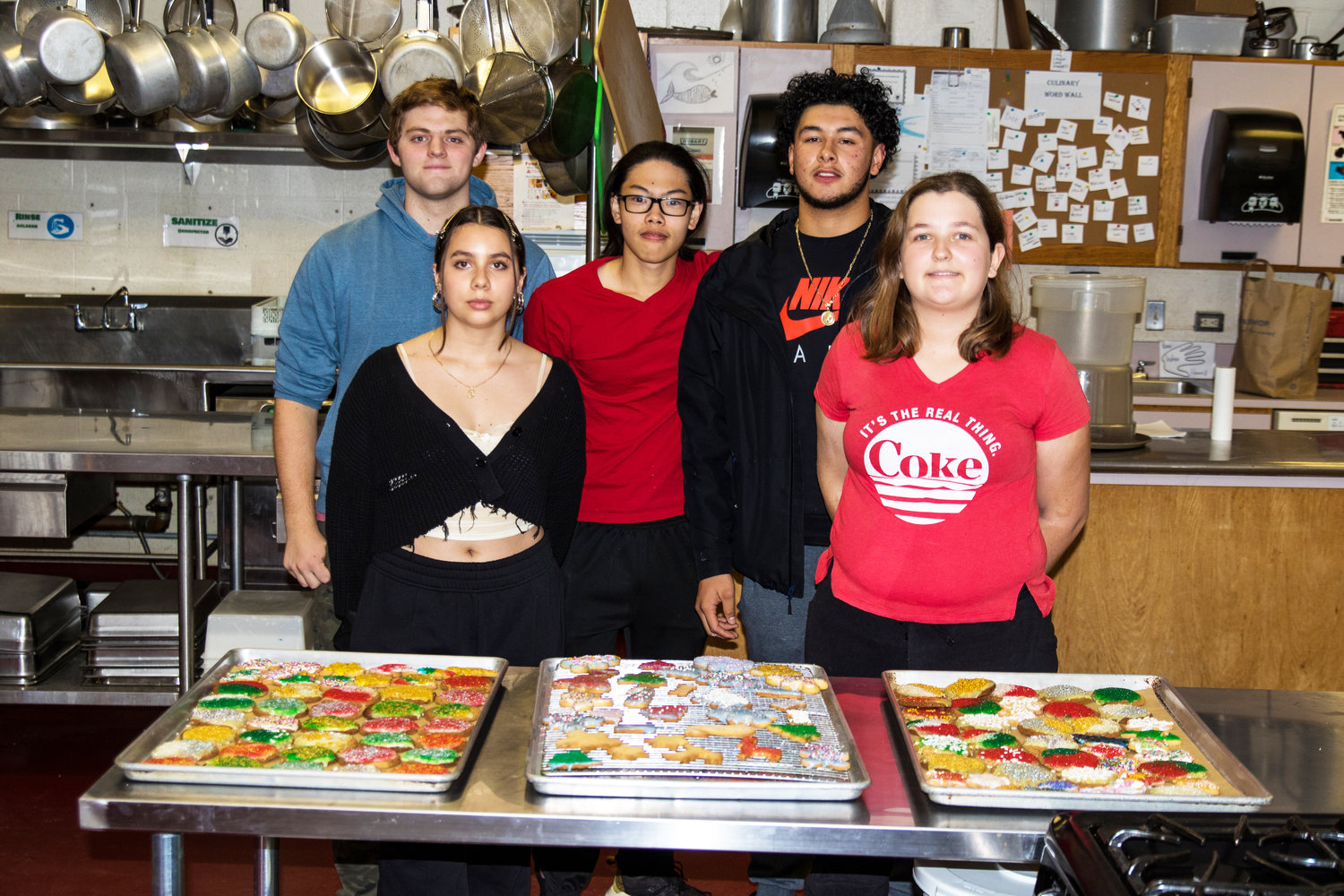 Evan Keeler, Sofia Deras, Suppanant On-in, Jose Partida and Abigail Borneman infront of the holiday cookies that they baked in Tom Proch's culinary class.